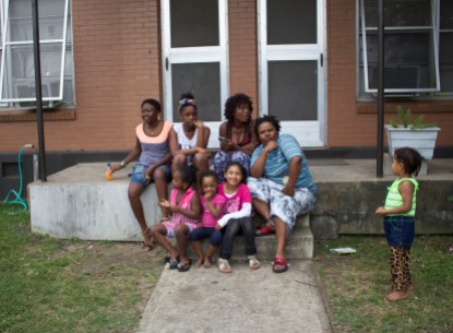 A large family sitting and talking outside of Rosewood Courts on May 5, 2015 in Austin, Texas.