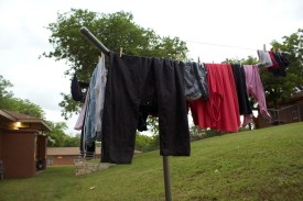 Rosewood Courts does not provide dryers for residents, so they typically hang their wet clothes on clothes lines. These residents just did laundry on May 5, 2015 in Austin, Texas